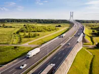 A view of trucks moving on a highway.
