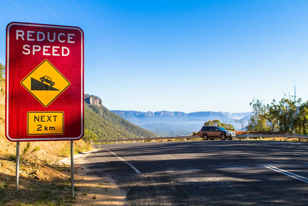 reduce speed australia photo by photoholgic on unsplash.jpg