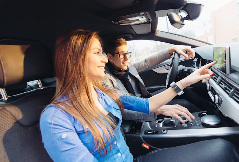 man woman couple car connected vehicles dashboard.png