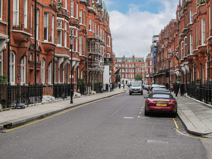 A delivery van drives along a side street in London, United Kingdom.