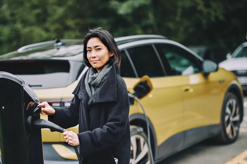 london 2 driver woman electric car vehicle ev automotive charging station blog