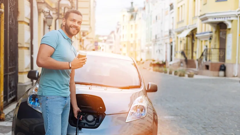 man charging electric vehicle 1 blog.jpg
