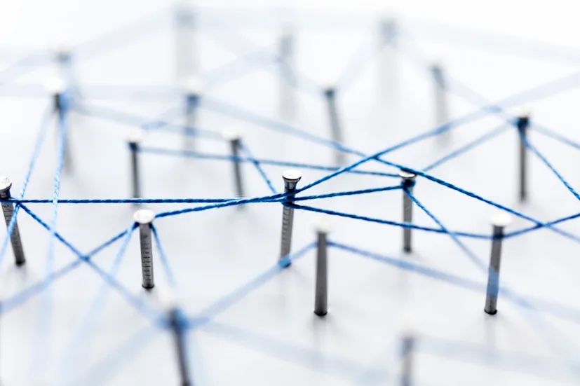 a large grid of pins connected with string communication technology network concept t20 v7nne8 blog.jpg