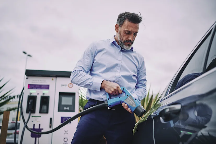 man-car-electric-vehicle-charge-charging-blog.jpg