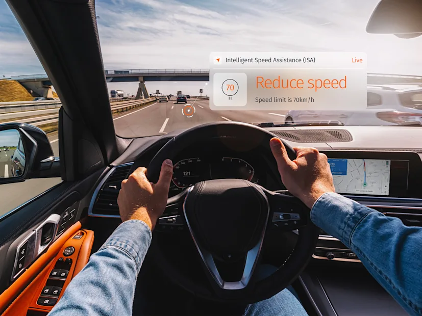 A driver's perspective of a digital dashboard displaying intelligent speed assistance.