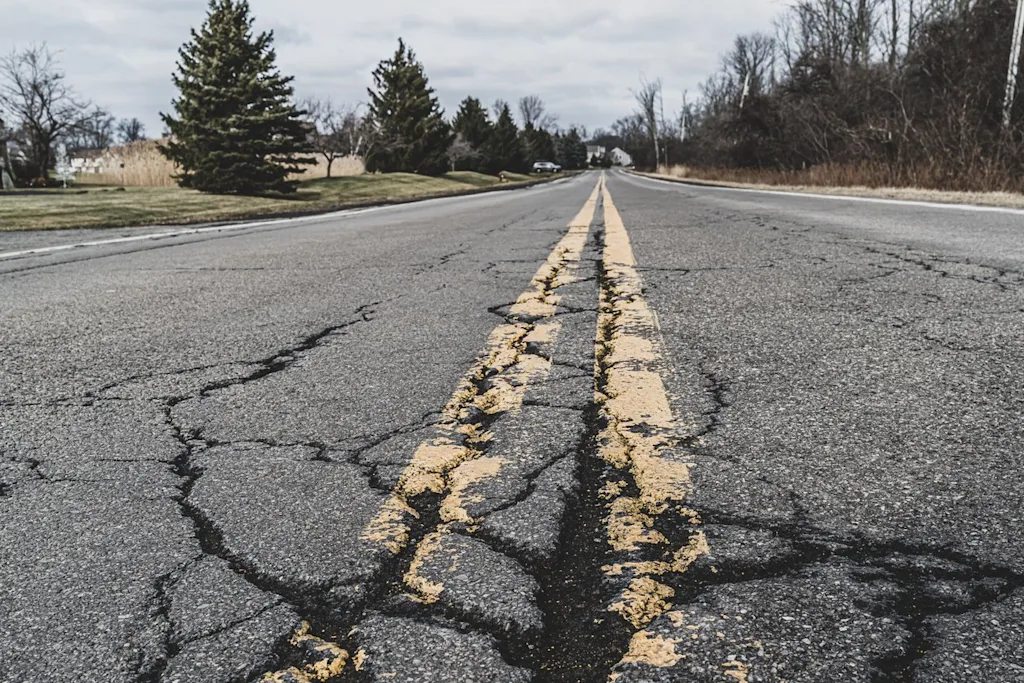 cracked road street pavement infrastructure blog