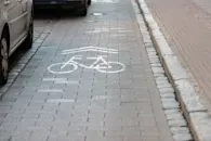 cobbled street with separate lanes for cyclists path bike lane cycle bicycle street background t20 gop44x blog.jpg