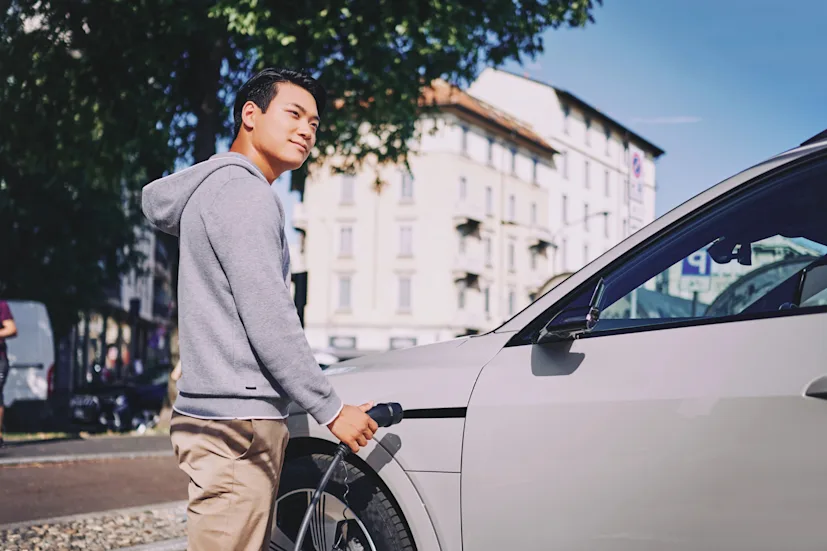 electric vehicle ev car man charging blog.jpg