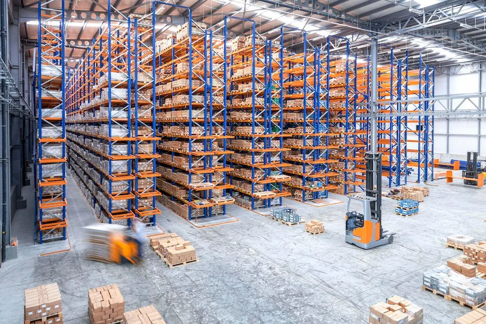 forklifts in large warehouse blog