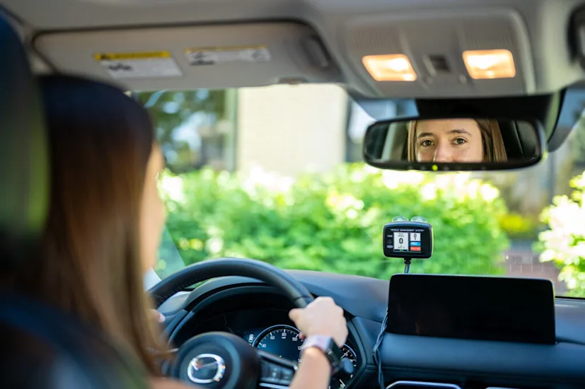 A teenager drives a car equipped with Sturdy SpeedIQ Active Speed Limiter.